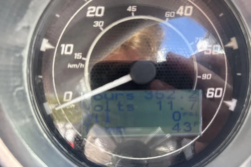 Slide: The Image of Close-up of a 2012 MasterCraft X-15 speedometer displaying 0 km/h and digital readings. - 14