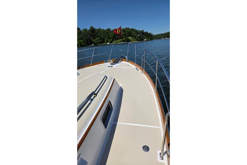 Slide: The Image of 2003 Grand Banks 49 Eastbay HX yacht deck with scenic water view. - 11