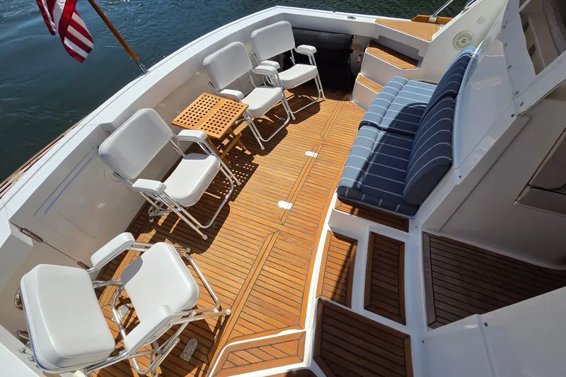 Slide: The Image of Spacious deck of 2003 Grand Banks 49 Eastbay HX with seating and wooden flooring. - 15