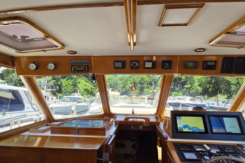 Slide: The Image of Interior view of 2003 Grand Banks 49 Eastbay HX yacht cockpit with navigation equipment. - 18