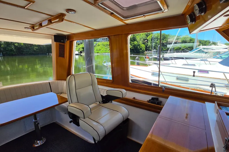 Slide: The Image of Interior of 2003 Grand Banks 49 Eastbay HX yacht with scenic marina view. - 21