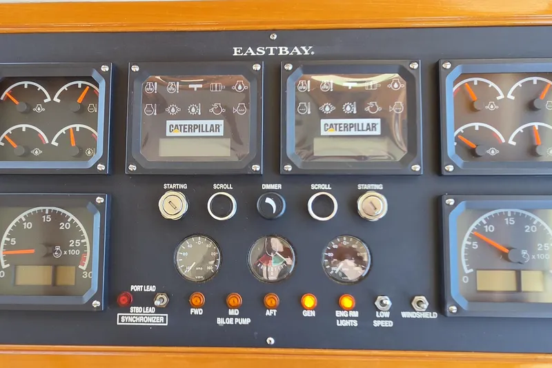 Slide: The Image of Instrument panel of a 2003 Grand Banks 49 Eastbay HX with Caterpillar gauges and controls. - 24