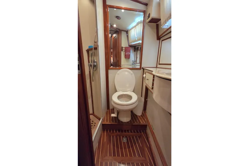 Slide: The Image of Bathroom interior of 2003 Grand Banks 49 Eastbay HX yacht, featuring wood accents and modern fixtures. - 37