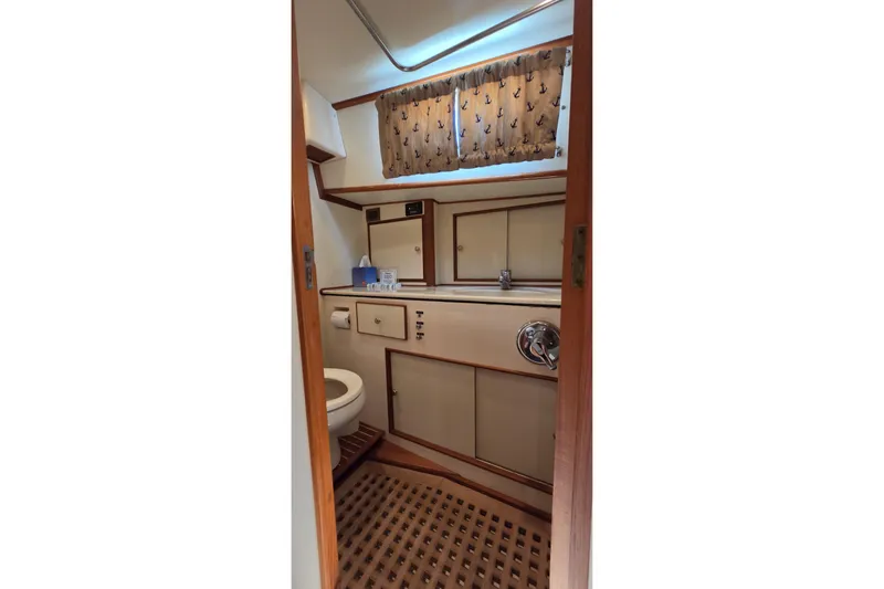 Slide: The Image of Bathroom interior of 2003 Grand Banks 49 Eastbay HX yacht, featuring nautical decor. - 43