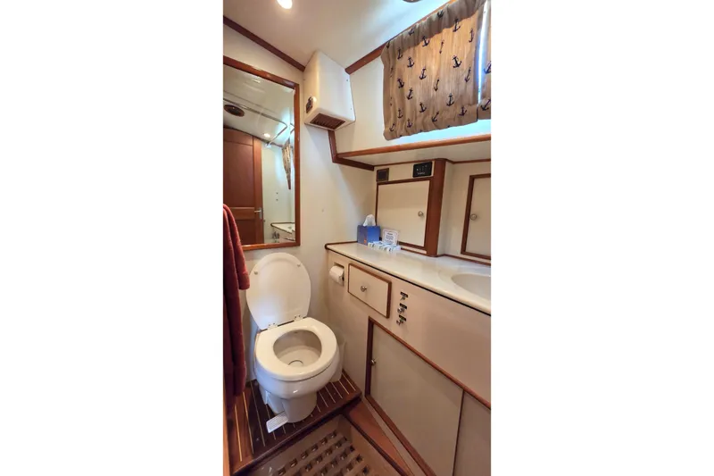 Slide: The Image of Bathroom interior of 2003 Grand Banks 49 Eastbay HX yacht, featuring toilet and sink. - 44