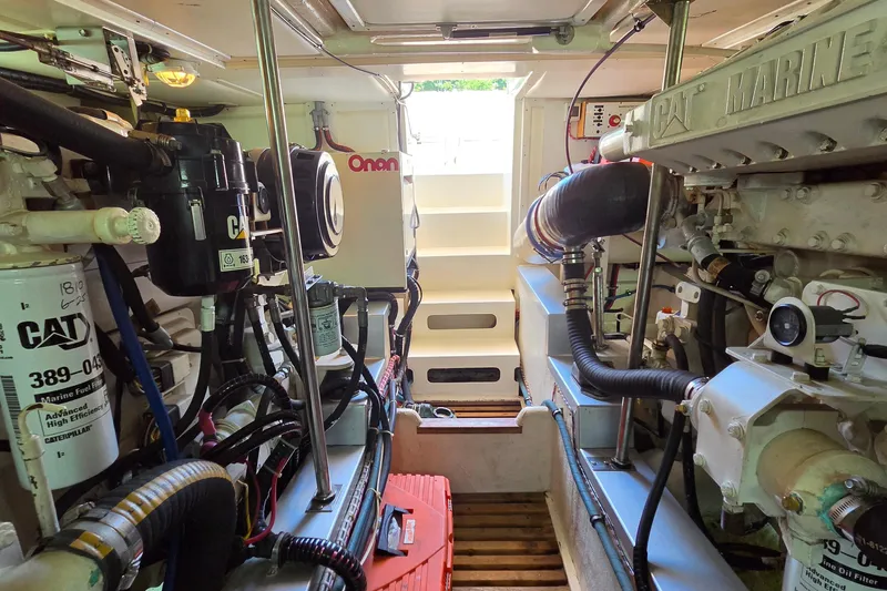 Slide: The Image of Engine room of 2003 Grand Banks 49 Eastbay HX with CAT marine engines and Onan generator. - 46