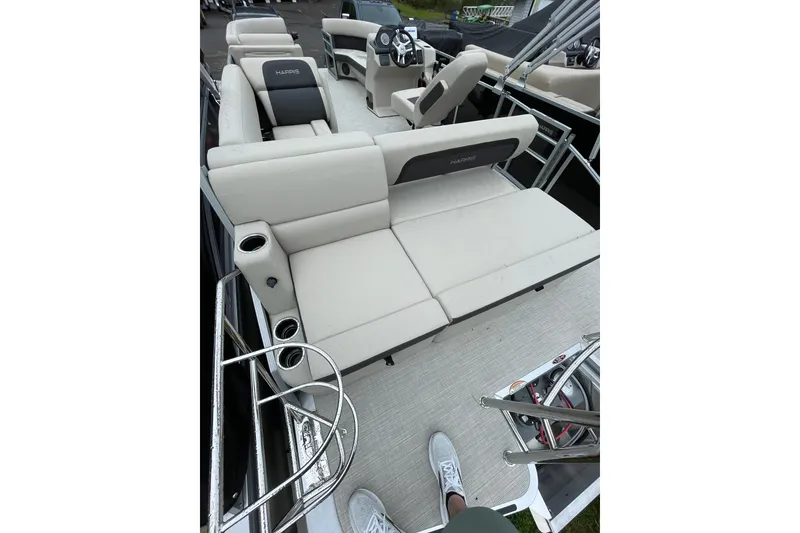 Slide: The Image of 2026 Harris Cruiser 230 SL pontoon boat interior with plush seating and modern design. - 10