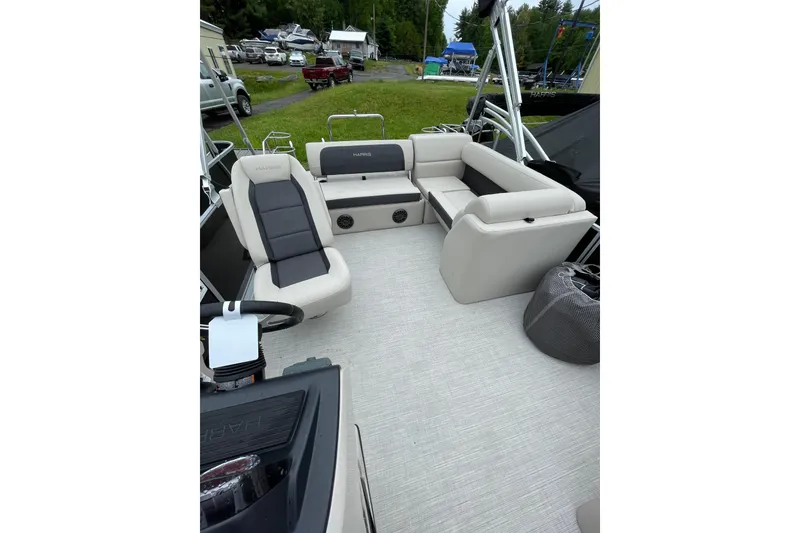 Slide: The Image of 2026 Harris Cruiser 230 SL pontoon boat interior with plush seating and modern design. - 11