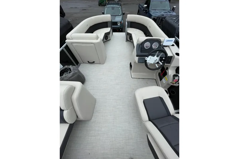 Slide: The Image of Interior view of 2026 Harris Cruiser 230 SL pontoon boat with plush seating and modern dashboard. - 3