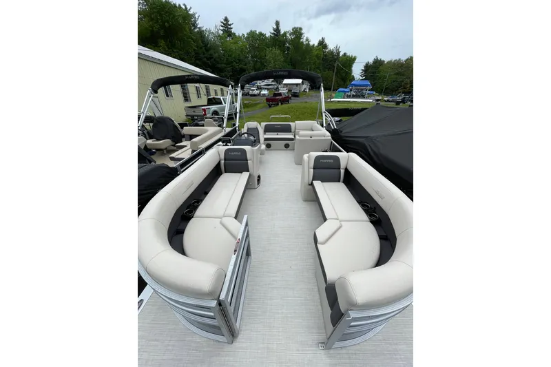Slide: The Image of 2026 Harris Cruiser 230 SL pontoon boat with spacious seating and modern design. - 4