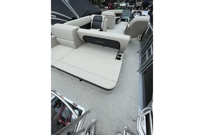 Slide: The Image of 2026 Harris Cruiser 230 SL pontoon boat interior with beige seating and modern design. - 8