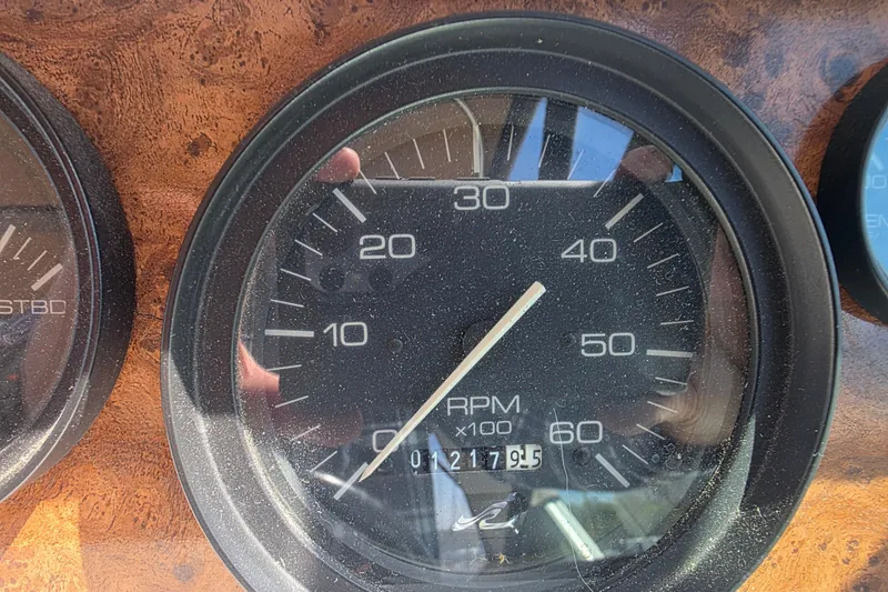 Slide: The Image of Tachometer of 1994 Sea Ray 370 Express Cruiser showing RPM and odometer reading. - 12