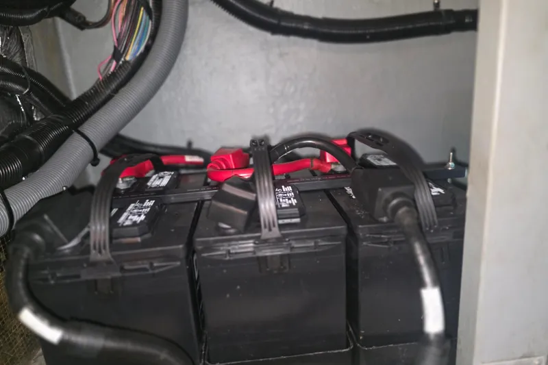Slide: The Image of Battery compartment of a 1994 Sea Ray 370 Express Cruiser with wiring and connections. - 28