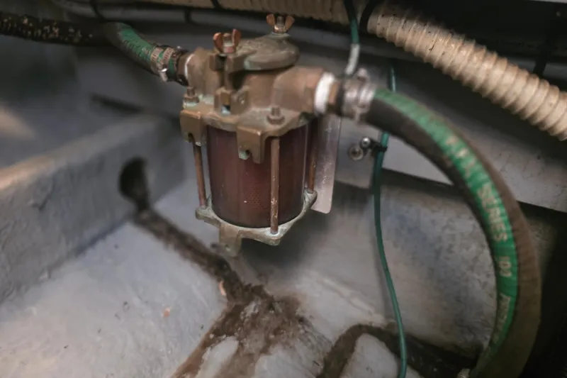 Slide: The Image of Fuel filter system in a 1994 Sea Ray 370 Express Cruiser engine compartment. - 33