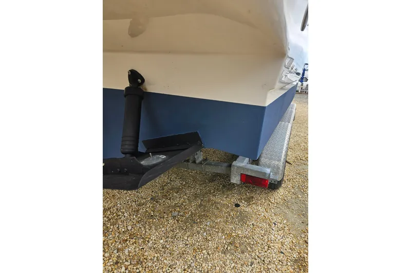 Slide: The Image of Rear view of 2007 Sea Ray 270 Sundancer on a trailer, showing hull and trailer details. - 14
