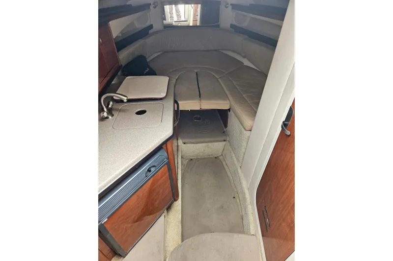 Slide: The Image of Interior cabin of 2007 Sea Ray 270 Sundancer with kitchenette and seating area. - 7