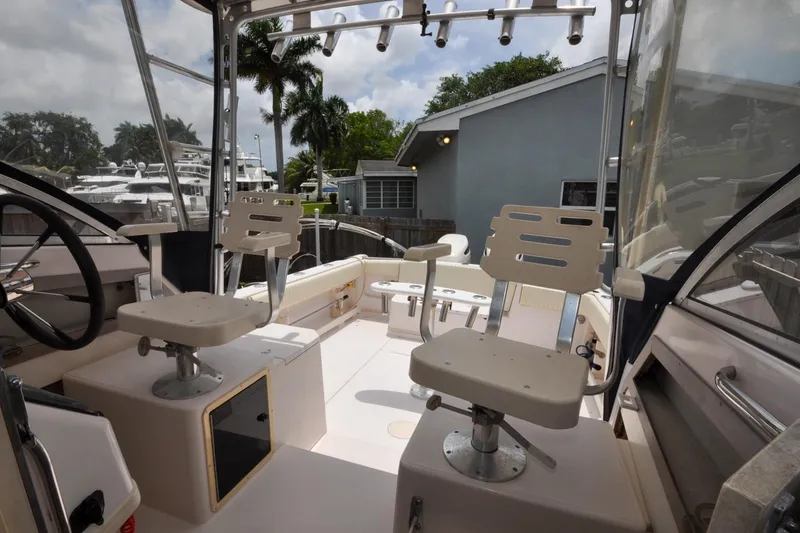 Slide: The Image of Interior view of 1997 Grady-White Marlin 300 boat with seating and steering wheel. - 15