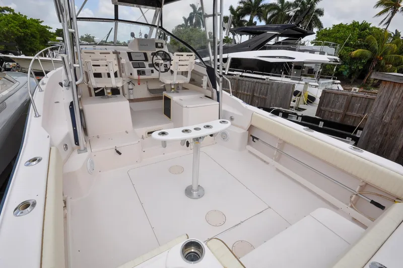 Slide: The Image of 1997 Grady-White Marlin 300 boat interior with helm and seating area. - 16