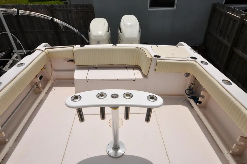 Slide: The Image of 1997 Grady-White Marlin 300 boat deck with seating and rod holders. - 5