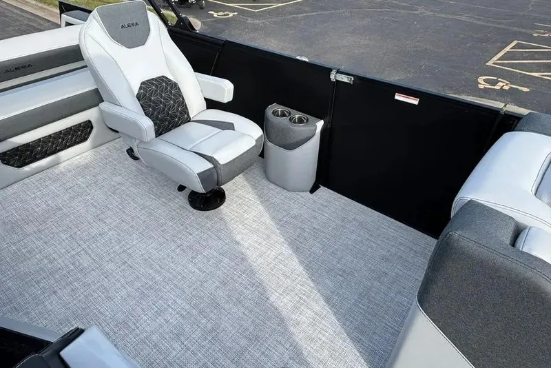 Slide: The Image of Luxurious seating area in 2026 Alera M25L boat with modern design and cup holders. - 1
