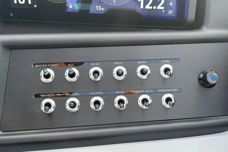 Slide: The Image of Control panel of Alera M25L 2026 boat with labeled switches and RGB lighting knob. - 11
