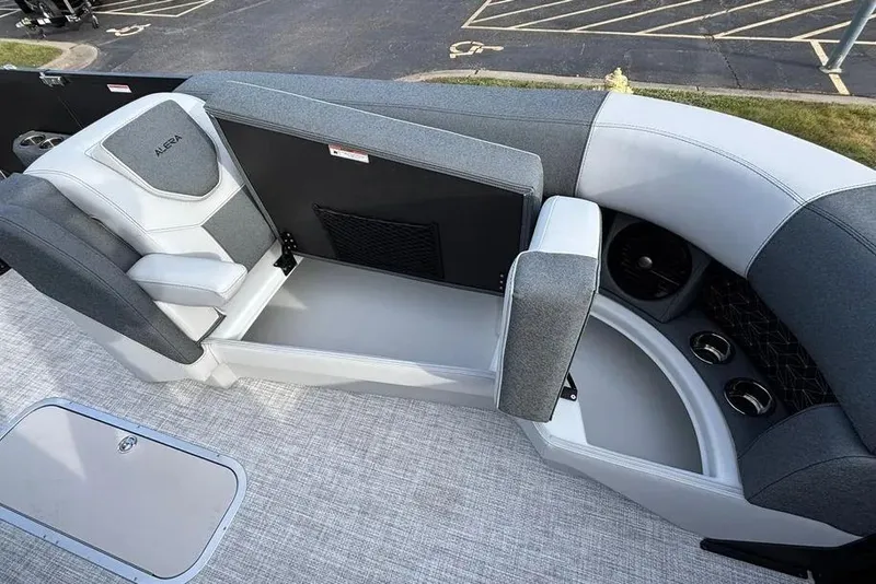 Slide: The Image of Interior of 2026 Alera M25L boat with gray seating and cup holders. - 13