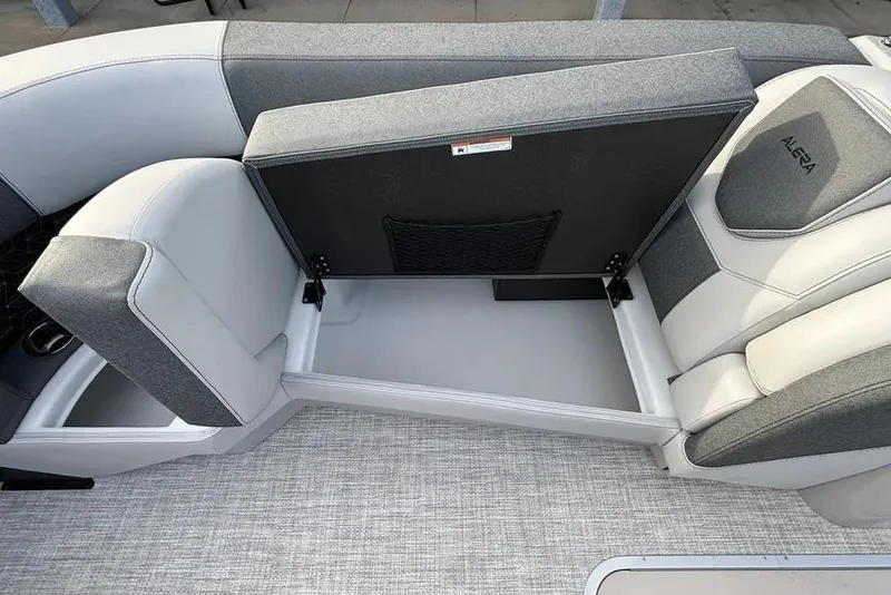 Slide: The Image of Alera M25L 2026 boat interior with open storage compartment and cushioned seating. - 7