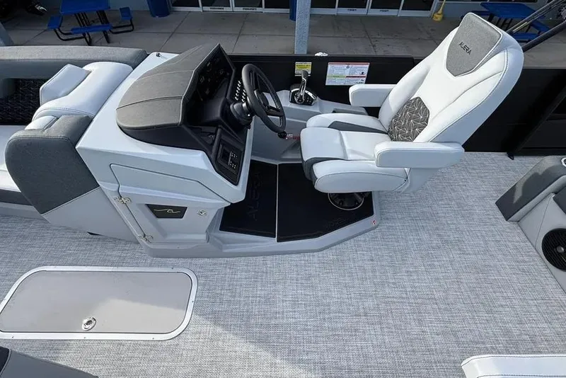 Slide: The Image of Captain's seat and helm of 2026 Alera M25L boat, featuring modern design and controls. - 8