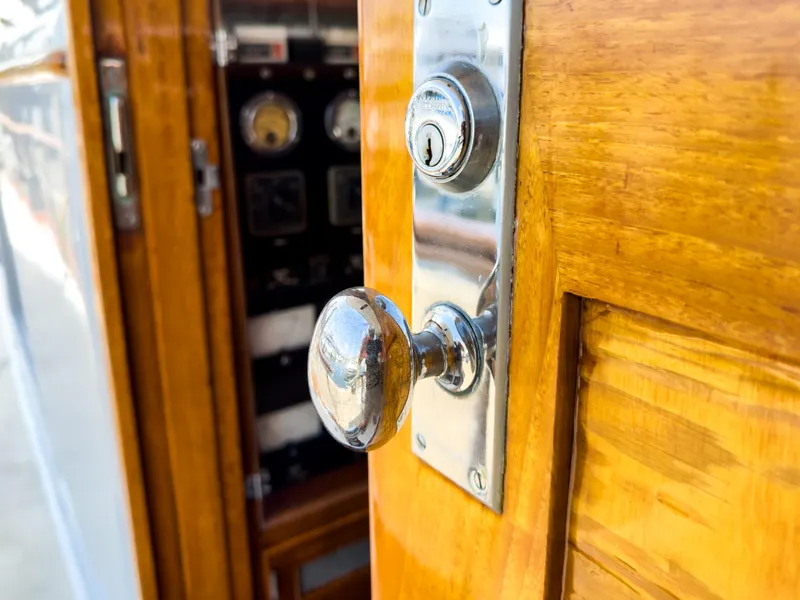 Slide: The Image of Wooden door handle of a 1971 Burger 64 Pilothouse Motoryacht. - 10