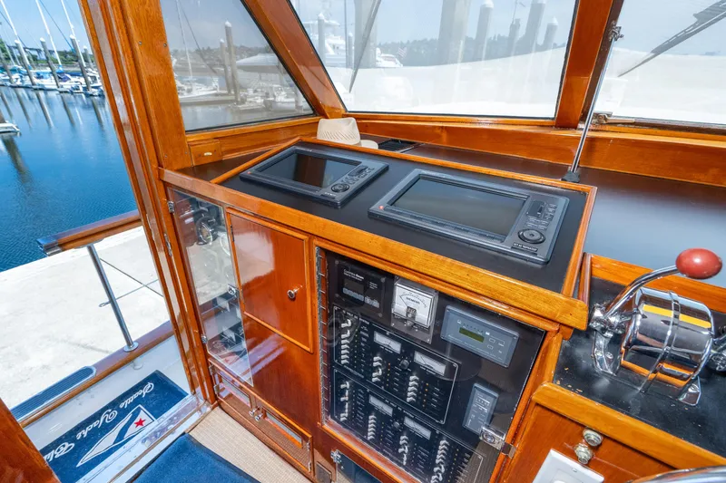 Slide: The Image of Helm of 1971 Burger 64 Pilothouse Motoryacht in harbor. - 17