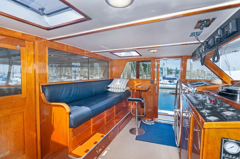 Slide: The Image of Interior of a 1971 Burger 64 Pilothouse Motoryacht with wooden furnishings. - 18