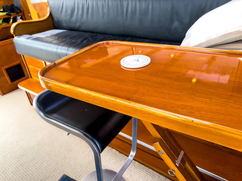 Slide: The Image of Interior of a 1971 Burger 64 Pilothouse Motoryacht with wooden table. - 20