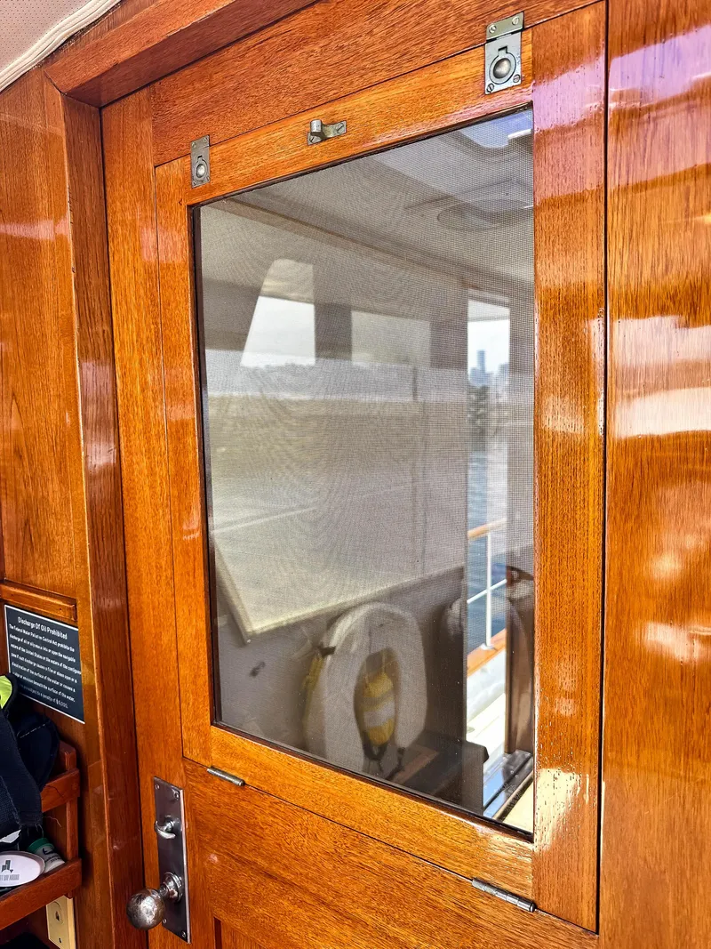 Slide: The Image of Wooden door on a 1971 Burger 64 Pilothouse Motoryacht. - 23
