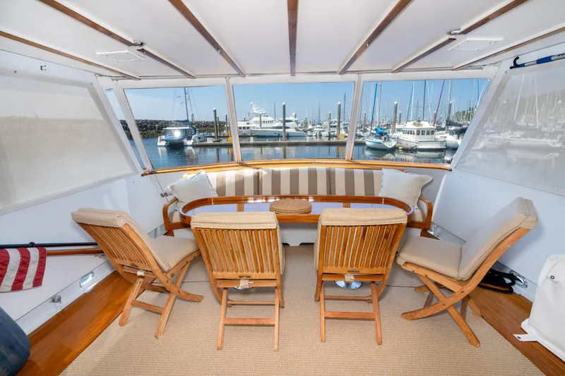 Slide: The Image of Interior of a 1971 Burger 64 Pilothouse Motoryacht with harbor view. - 25