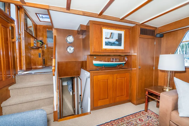 Slide: The Image of Interior of 1971 Burger 64 Pilothouse Motoryacht with wooden furnishings and model boat. - 31