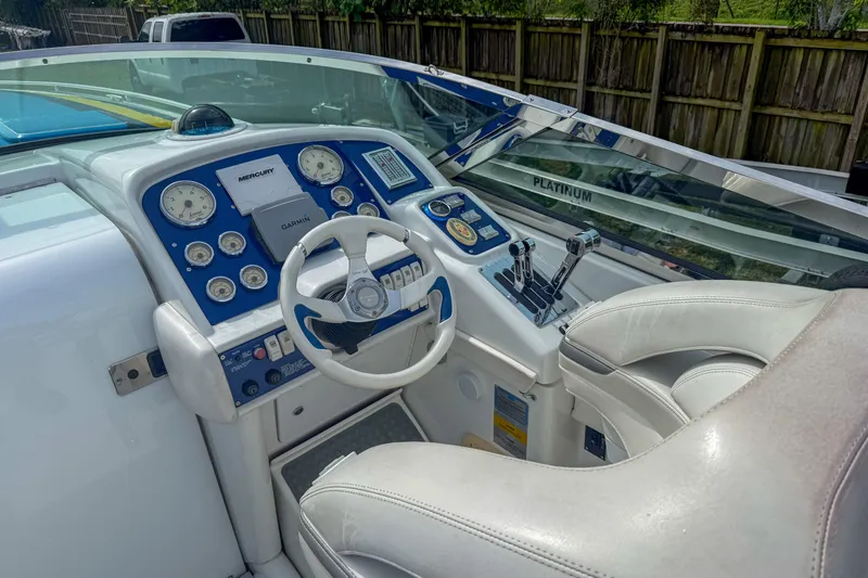Slide: The Image of 2006 Formula 382 FASTech boat cockpit with steering wheel and control panel. - 1