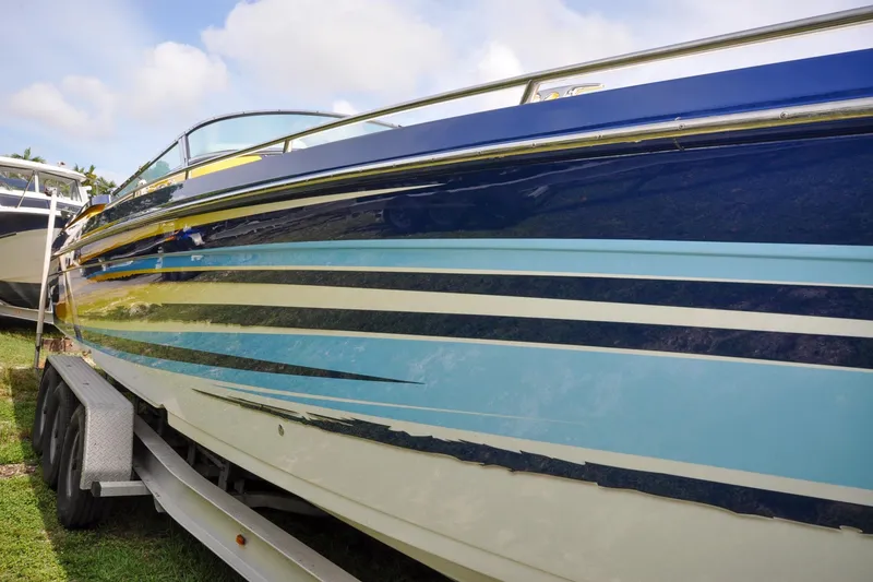 Slide: The Image of 2006 Formula 382 FASTech boat with blue and white stripes on a trailer. - 17