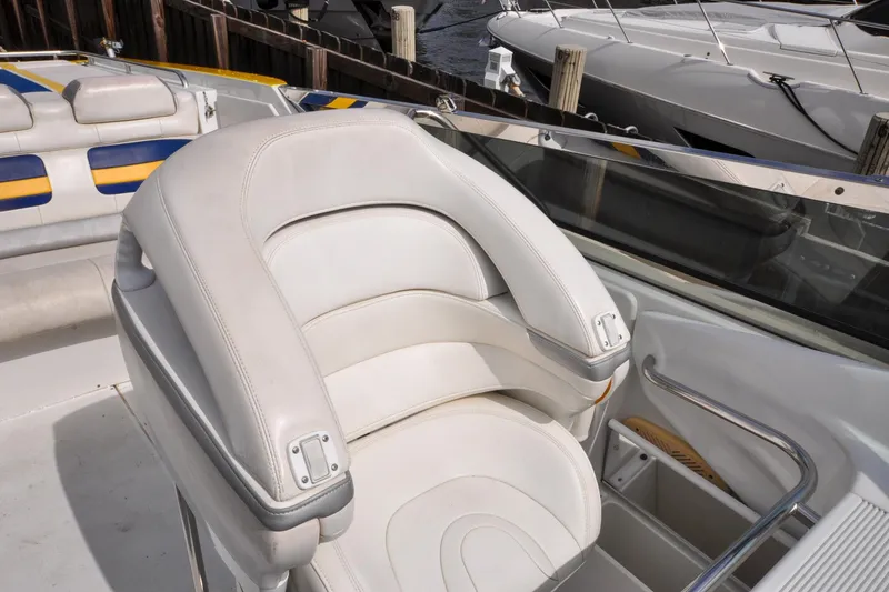 Slide: The Image of 2006 Formula 382 FASTech boat interior with white leather seating and sleek design. - 26