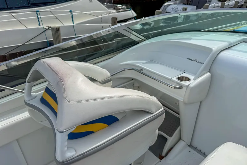 Slide: The Image of 2006 Formula 382 FASTech boat interior with white and blue seating. - 27