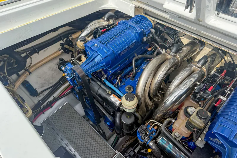Slide: The Image of Engine compartment of a 2006 Formula 382 FASTech boat, featuring a powerful blue engine. - 29