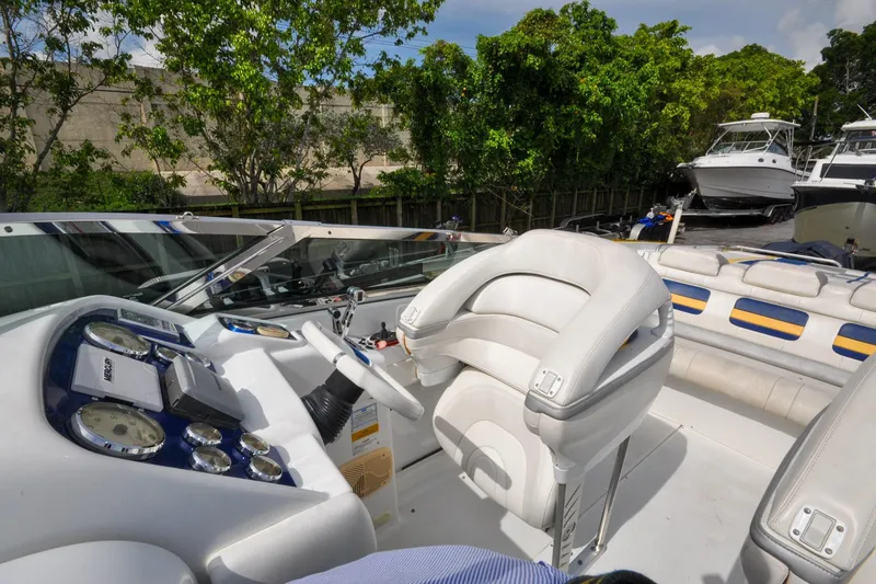 Slide: The Image of 2006 Formula 382 FASTech boat interior with steering wheel and seating. - 3