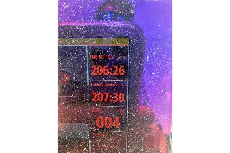 Slide: The Image of Dashboard display of a 2006 Formula 382 FASTech boat with engine hours and course data. - 36