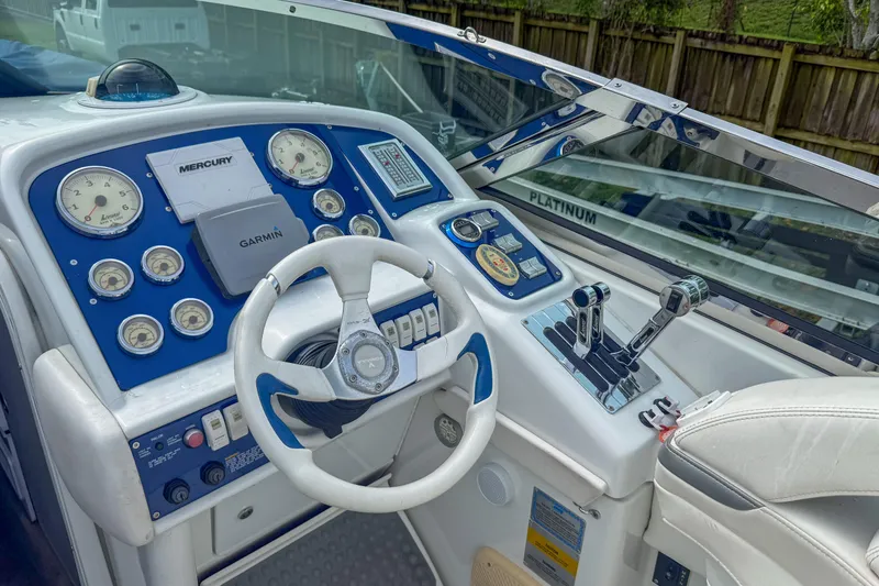 Slide: The Image of 2006 Formula 382 FASTech boat dashboard with Mercury and Garmin instruments. - 5