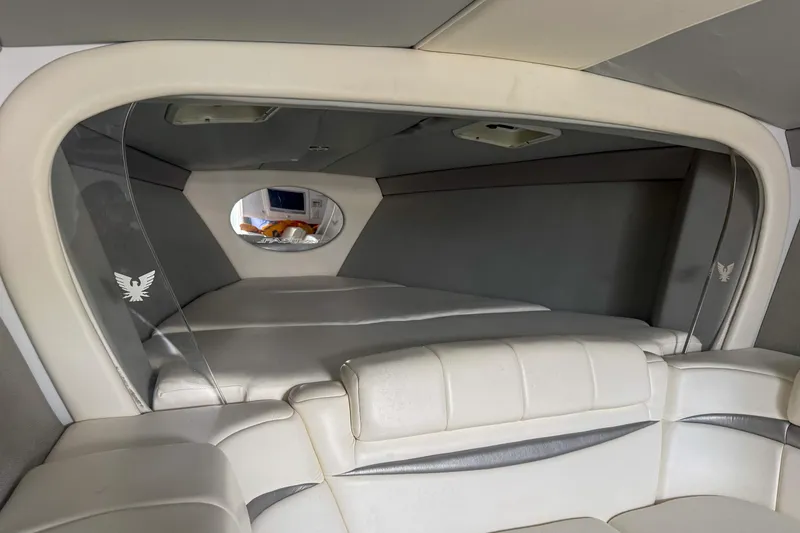 Slide: The Image of Interior of 2006 Formula 382 FASTech boat with white leather seating and modern design. - 6