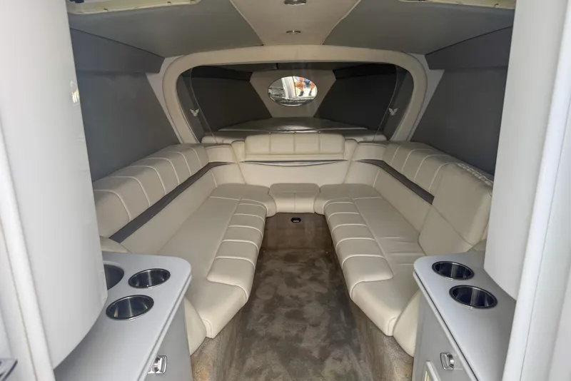 Slide: The Image of Interior of a 2006 Formula 382 FASTech boat with beige seating and cup holders. - 7
