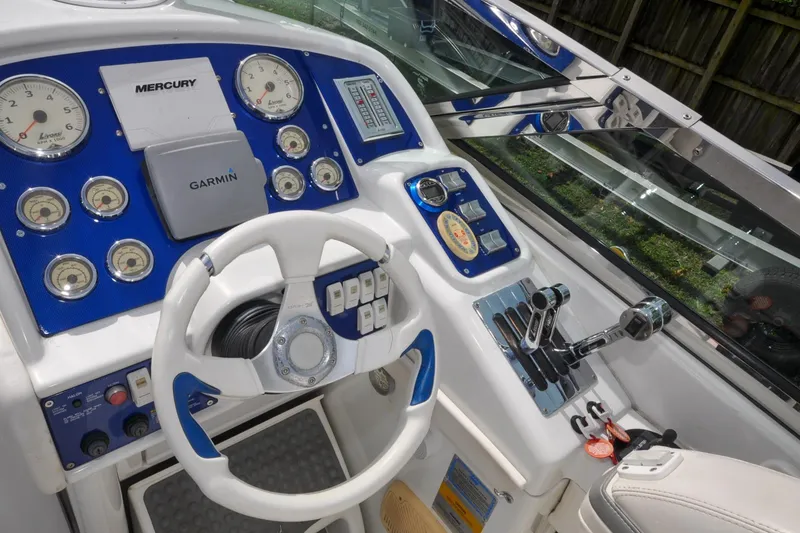 Slide: The Image of Cockpit of 2006 Formula 382 FASTech with steering wheel, gauges, and controls. - 8