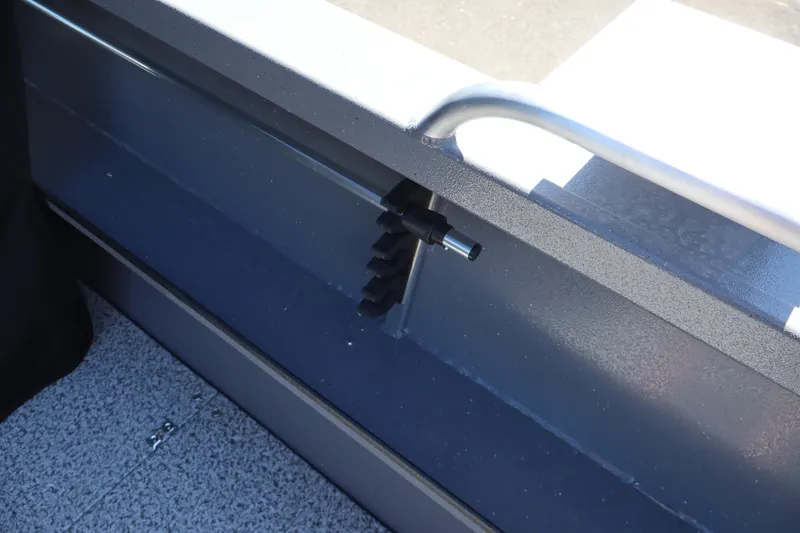 Slide: The Image of 2026 Alumaweld Talon 18 boat interior detail with metal railing and textured flooring. - 11