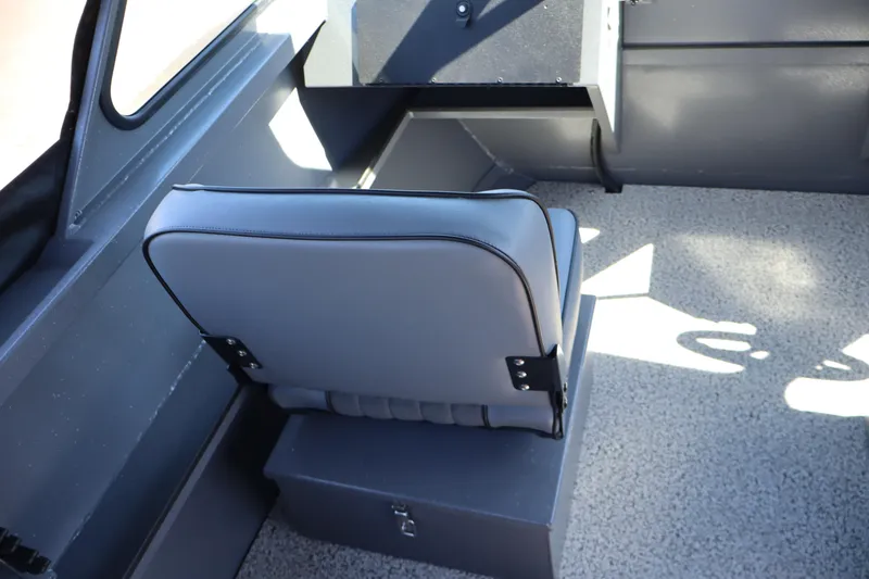 Slide: The Image of Interior of 2026 Alumaweld Talon 18 boat with gray seating and storage compartment. - 14