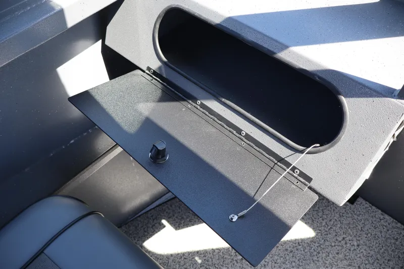 Slide: The Image of Open storage compartment in 2026 Alumaweld Talon 18 boat interior. - 18