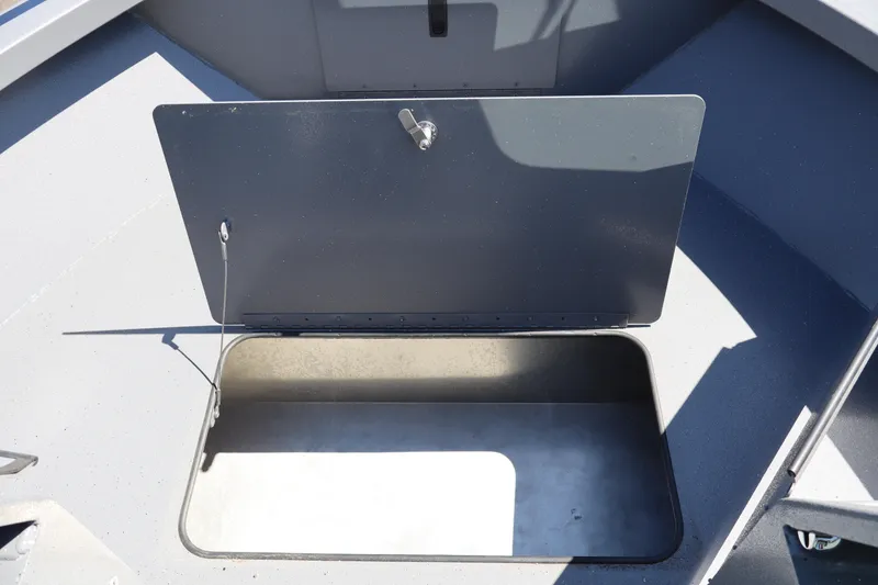 Slide: The Image of Open storage compartment on 2026 Alumaweld Talon 18 boat deck. - 21